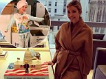 Ivanka Trump poses next to Donald's inauguration cake