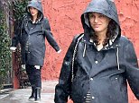 Pregnant Natalie Portman nearly bursts out of raincoat