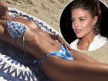 Chloe Lewis shows off her figure in racy tie-dye swimwear