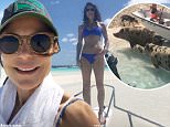 Bethenny Frankel in bikini as she visits swimming pigs