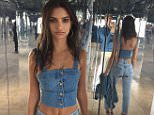 Emily Ratajkowski flashes her midriff in double denim