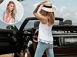 Jennifer Hawkins shows off her convertible Range Rover