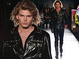 Jordan Barrett struts the runway for Moschino in all black