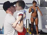 Wayne Rooney showers young sons in sweet kisses