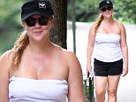 Amy Schumer works on her tan during workout in New York