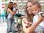 Tyra Banks cuts cool figure as she carries son York in NY 