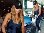 Rita Ora cuts effortlessly chic figure arriving in the UK