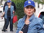 Singer Lulu,, 68, turns heads in London in double denim