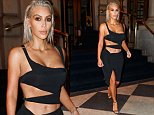 Kim Kardashian flashes her navel in slashed LBD