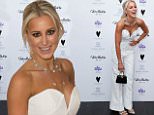 Roxy Jacenko shows off busty cleavage in white jumpsuit