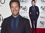 Armie Hammer stylish in burgundy and blue check suit in NY