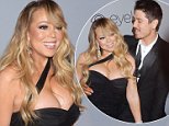 Mariah Carey's toyboy Bryan Tanaka kisses her hand