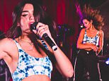 Dua Lipa flaunts her washboard abs as she performs after getting wisdom teeth removed