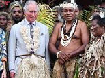 Prince Charles dons a grass skirt for traditional ceremony in Vanuatu during historic one-day visit