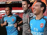 Santi Cazorla jogs around Emirates pitch ahead of Europa League semi-final