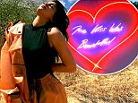 Kylie Jenner strikes sultry pose on hike… before showing off romantic neon signs in her house