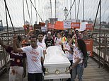 Thousands march across NYC's Brooklyn Bridge in gun…