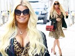 Jessica Simpson barely contains her bust in a sexy cheetah print frock for her third look of the day