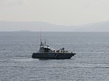 Volunteer divers search the sea for Greek fire victims