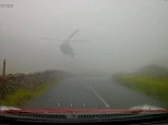 Heart-stopping moment 'SAS helicopter' suddenly swoops over fog-bound mountain road in Lake District