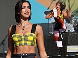 Dua Lipa takes to the stage in checked crop top and 90s-inspired trousers at Reading Festival