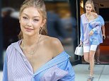 Gigi Hadid shows off her long legs in tight shorts with button-up top